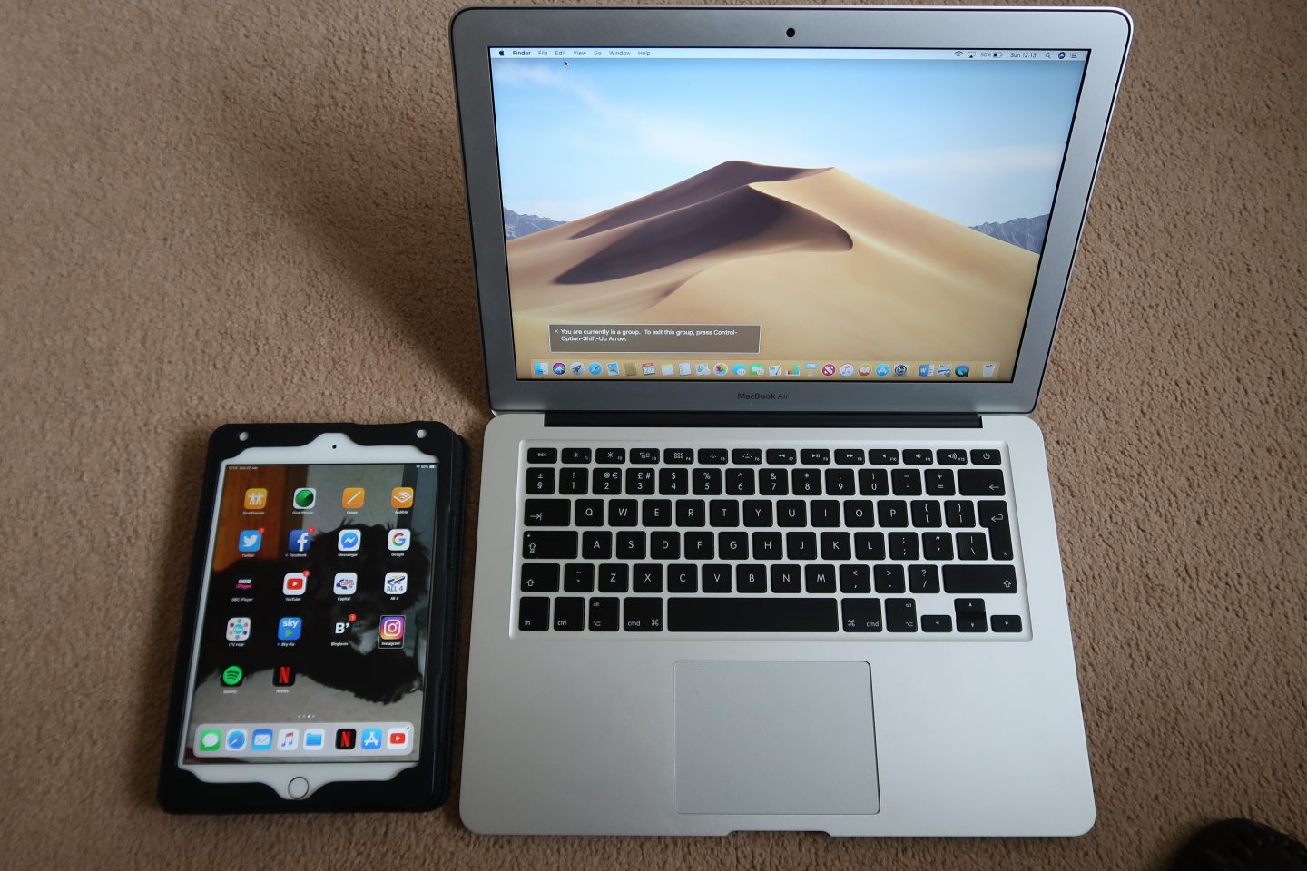A photo of an iPad and MacBook