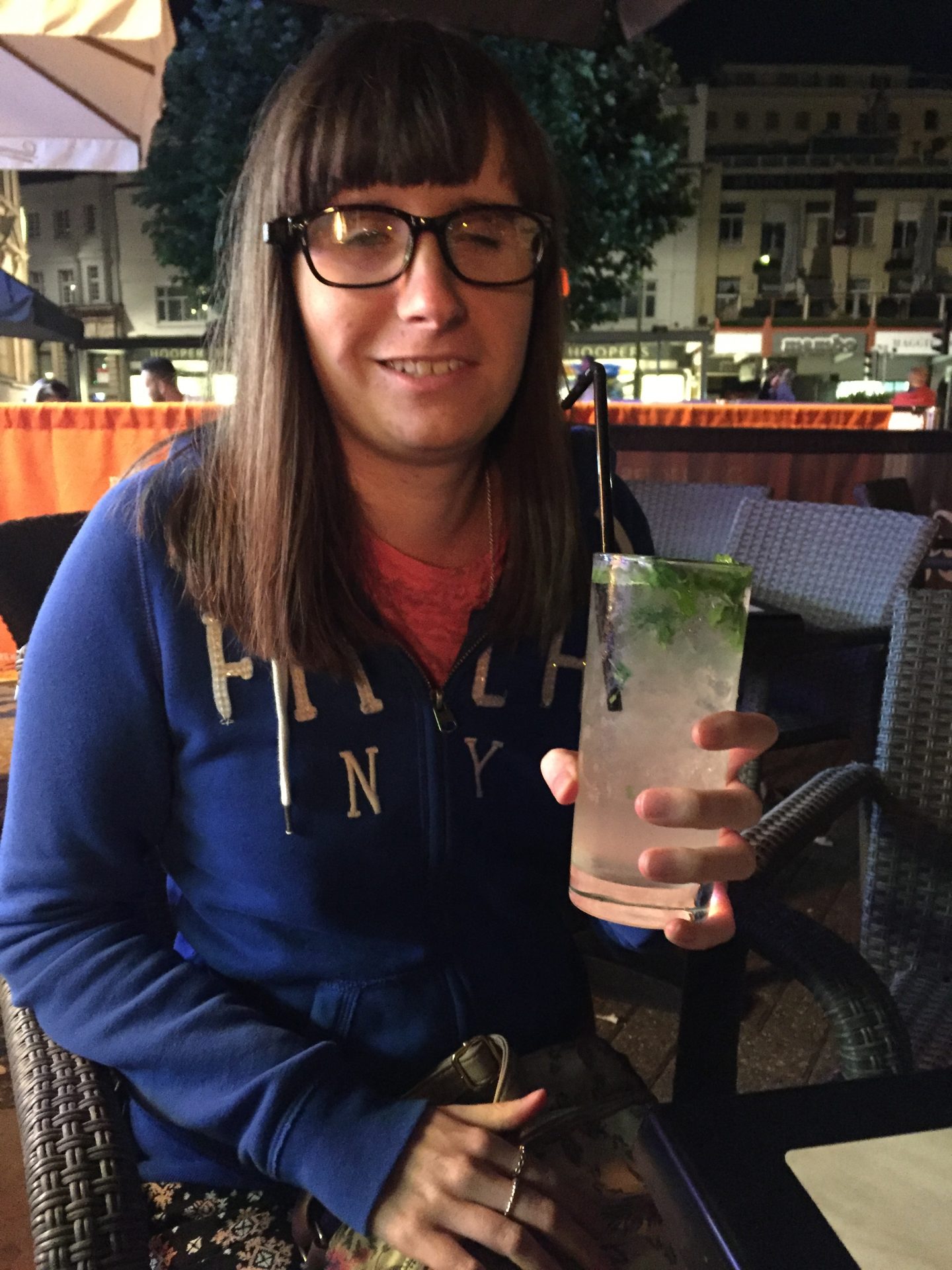 A photo of Holly with a drink in her hand