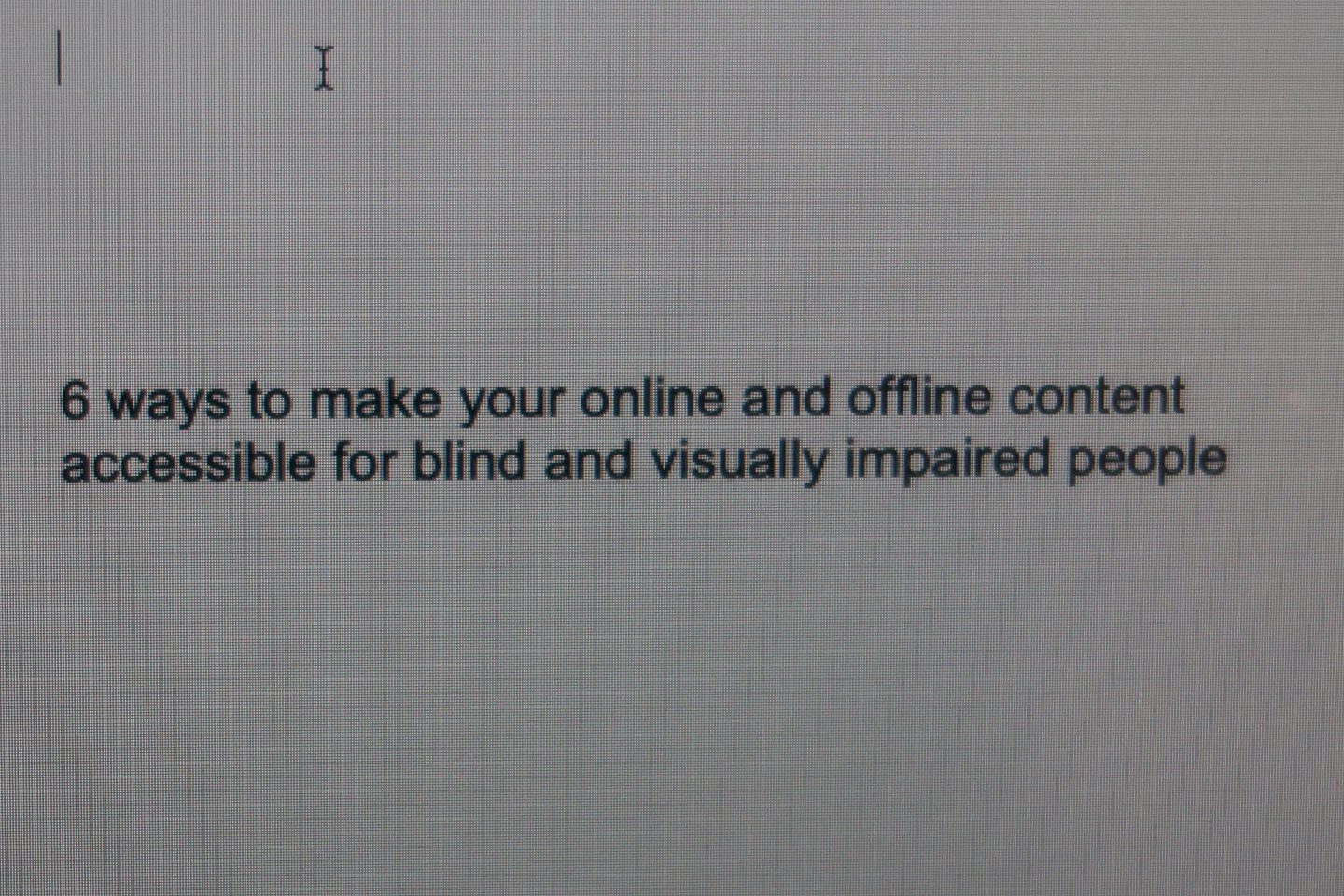 A word document open on a MacBook screen which says '6 ways to make your online and offline content accessible for blind and visually impaired people'