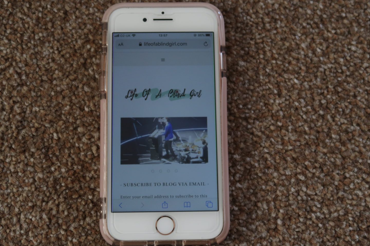 An iPhone with Holly's blog on the screen